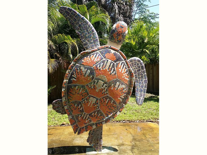 Art sculpture of a turtle made from carved EPS expanded polystyrene foam Styrofoam covered by tiles