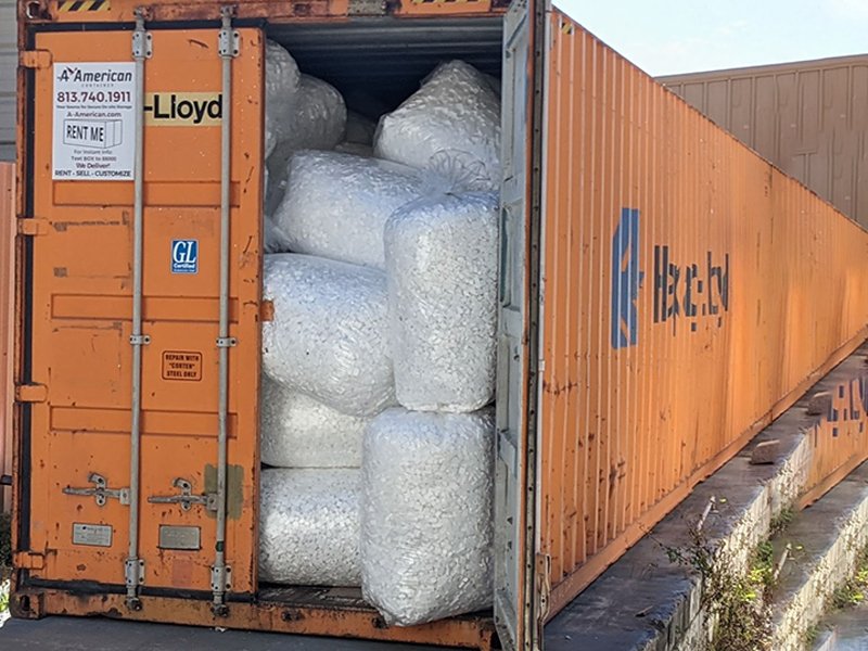 Bags of loose fill packaging in a shipping container