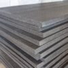 Black polyethlyene PE foam sheets that are 4' x 9' stacked in a pile