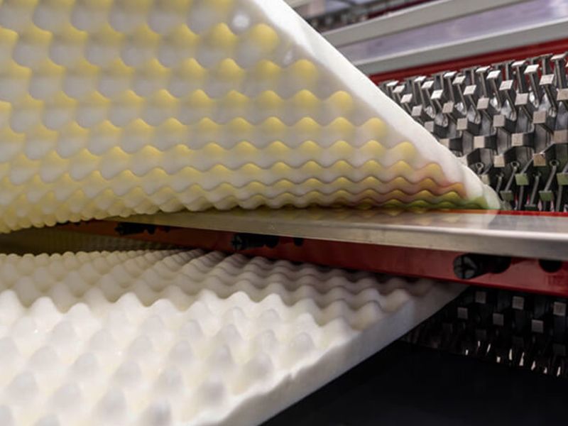 Machine manufacturing convoluted eggcrate foam