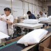 Manufacturing pillows filled with shredded foam in a factory